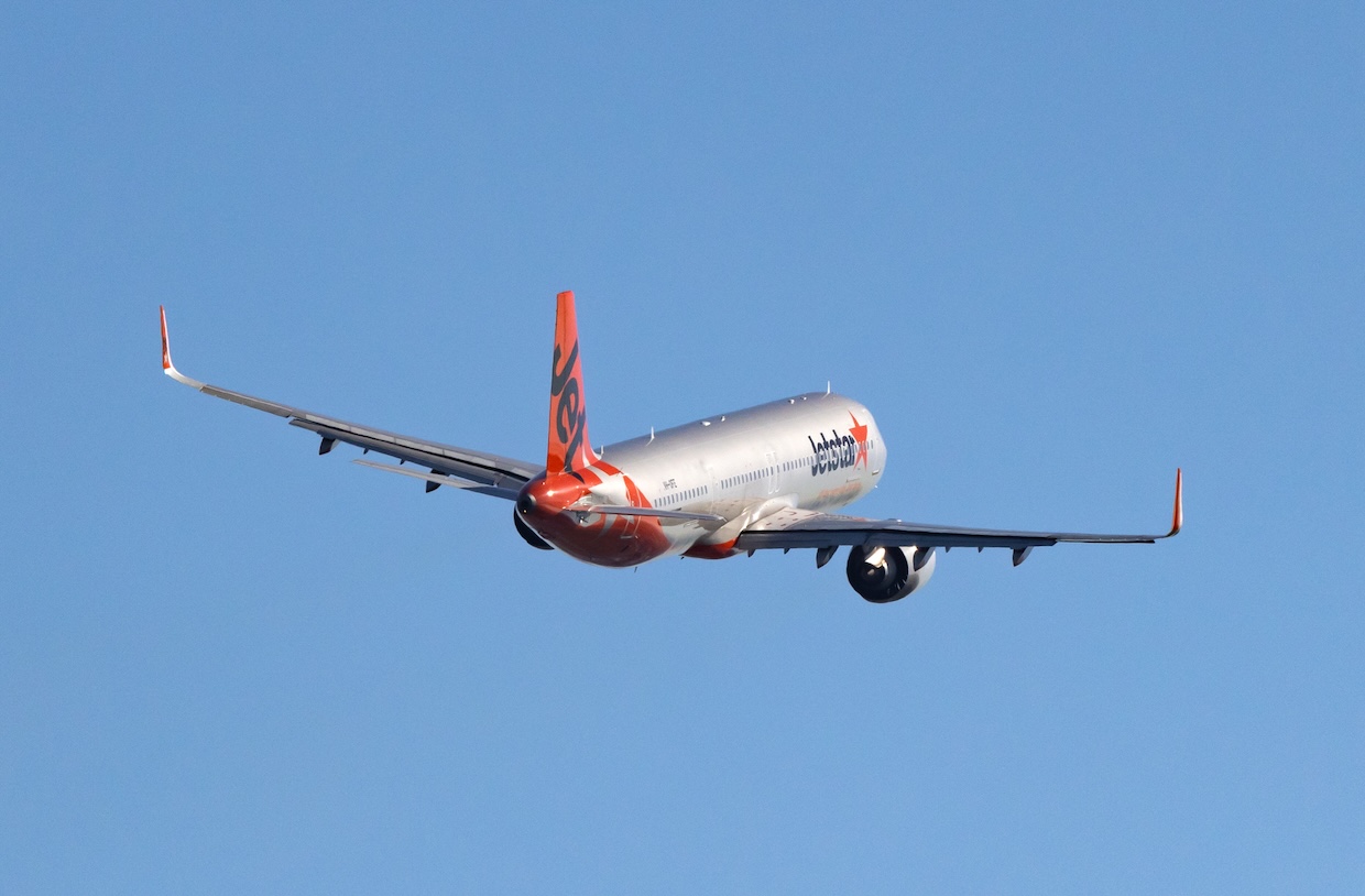 Jetstar flight to Bali with tradie knowing AI receptionist is handling business calls
